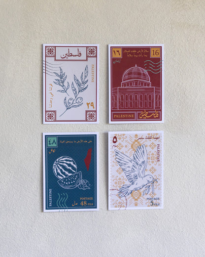 Four postcards with designs inspired by palestinian culture on a wooden bench