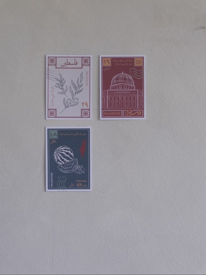 A stop motion clip of a woman sticking a fourth postcard to a wall with designs inspired by palestinian culture 