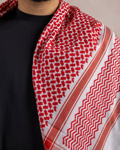 close up of a red and white palestinian keffiyeh
